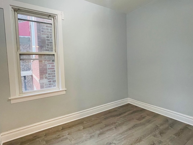 3106 S May St, Chicago, IL 60608 - spare room with dark wood-style flooring and baseboards