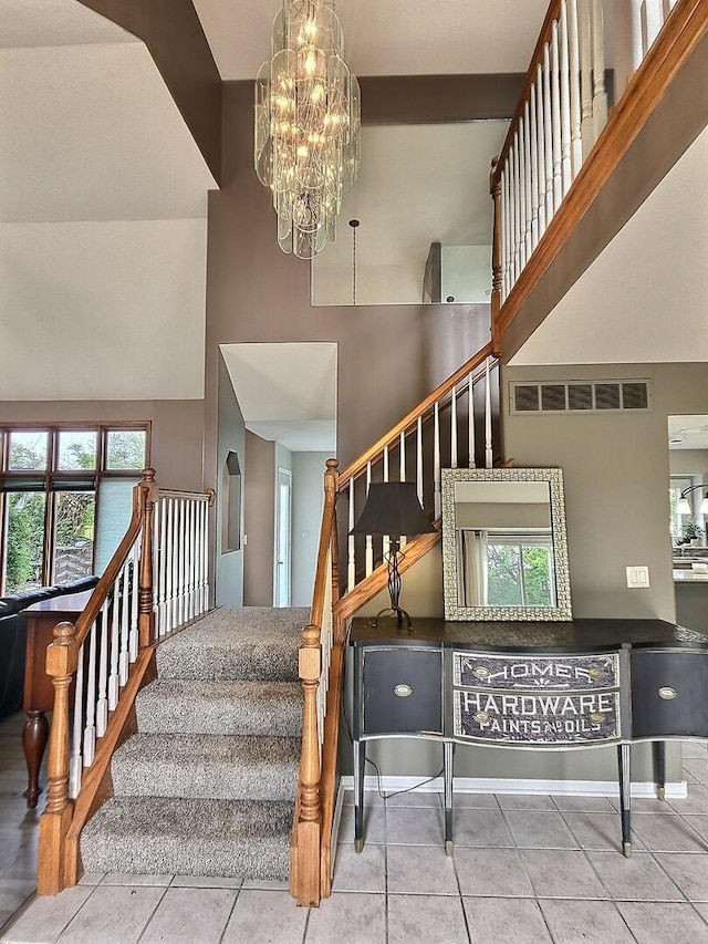 23243 S Volbrecht Rd, Crete, IL 60417 - staircase featuring a high ceiling, a chandelier, healthy amount of natural light, and tile patterned floors