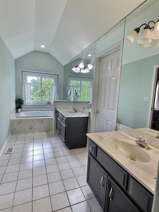 23243 S Volbrecht Rd, Crete, IL 60417 - bathroom with vaulted ceiling, two vanities, a bath, and tile patterned flooring