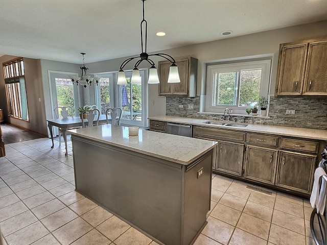 23243 S Volbrecht Rd, Crete, IL 60417 - kitchen featuring a sink, a center island, tasteful backsplash, plenty of natural light, and recessed lighting