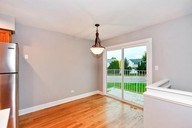 608 Inverrary Ln Unit 608, Deerfield, IL 60015 - unfurnished dining area with light wood finished floors and baseboards