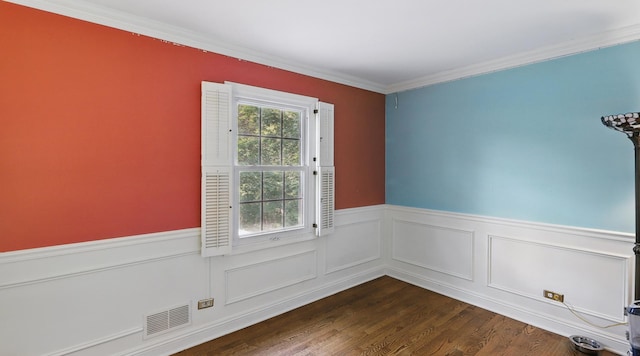 533 Warwick Dr, Naperville, IL 60565 - spare room featuring wainscoting, crown molding, and dark wood-style floors