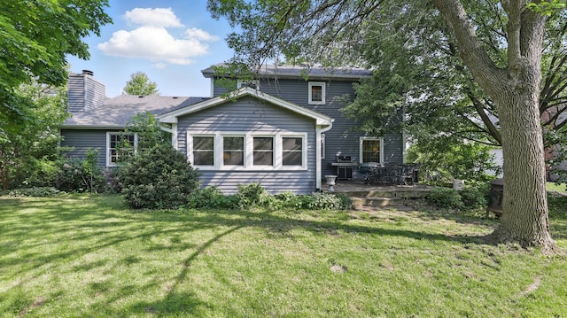 533 Warwick Dr, Naperville, IL 60565 - rear view of property featuring a yard, a chimney, and a deck