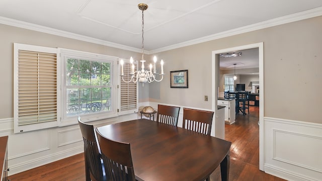 533 Warwick Dr, Naperville, IL 60565 - dining room with a chandelier, dark wood-type flooring, crown molding, a wainscoted wall, and a decorative wall