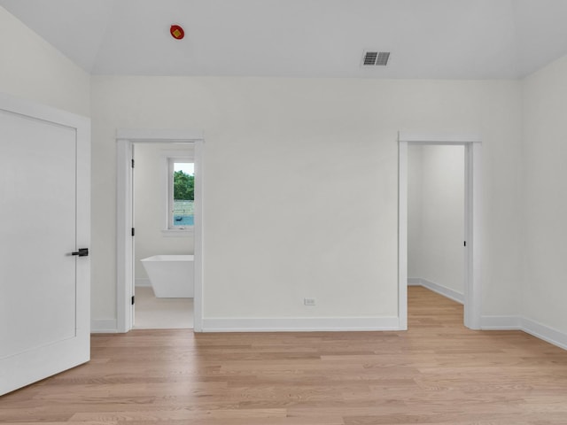 4845 N Mcvicker Ave, Chicago, IL 60630 - empty room with light wood-type flooring and vaulted ceiling