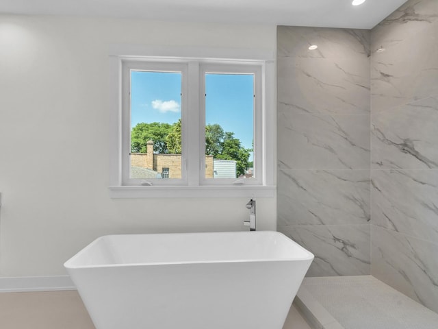4845 N Mcvicker Ave, Chicago, IL 60630 - bathroom featuring healthy amount of natural light, a soaking tub, and recessed lighting