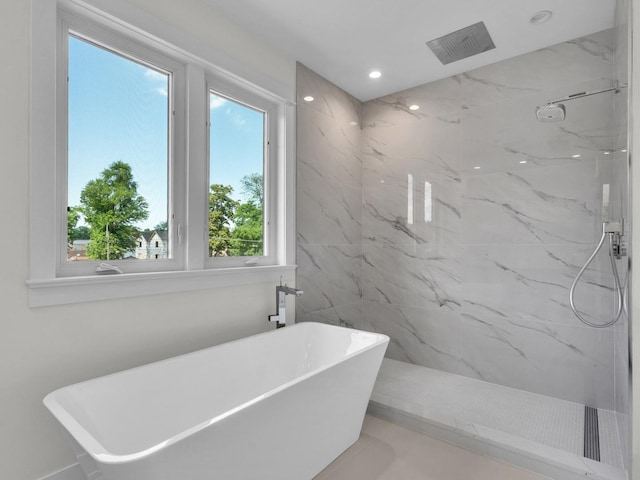 4845 N Mcvicker Ave, Chicago, IL 60630 - bathroom with a soaking tub, a marble finish shower, and recessed lighting