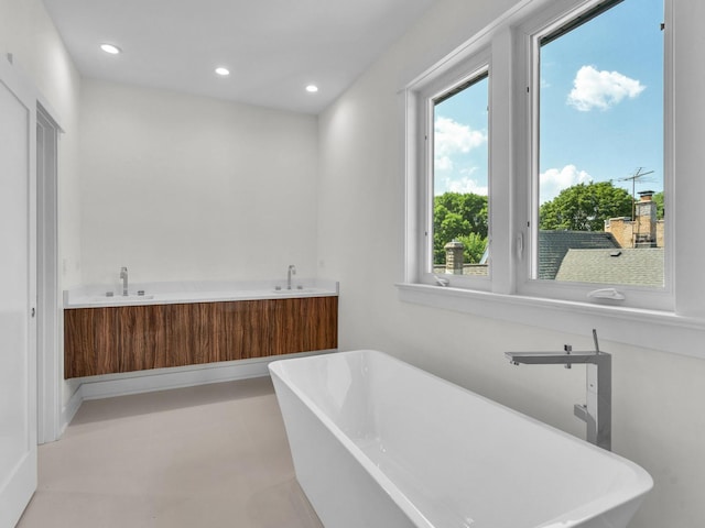 4845 N Mcvicker Ave, Chicago, IL 60630 - bathroom with a freestanding tub, recessed lighting, and double vanity