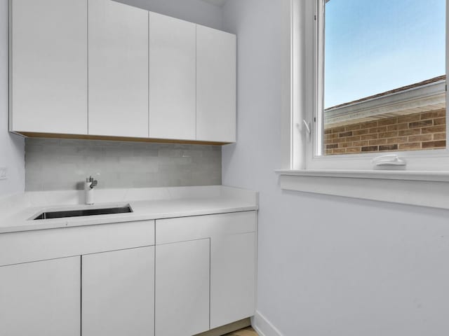 4845 N Mcvicker Ave, Chicago, IL 60630 - kitchen with white cabinetry and light countertops