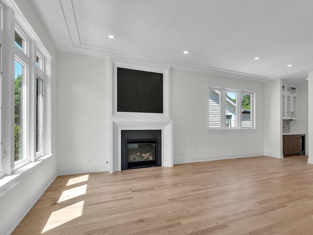 4845 N Mcvicker Ave, Chicago, IL 60630 - unfurnished living room featuring a large fireplace, light wood-style flooring, and recessed lighting