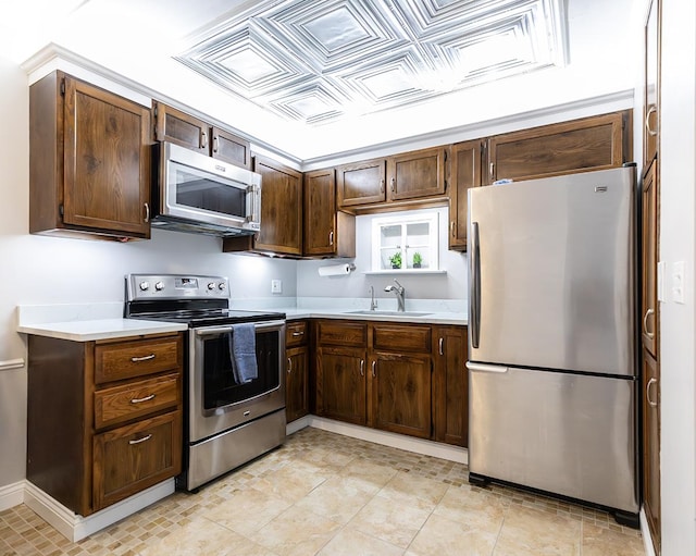 320 Circle Ave Unit 102, Forest Park, IL 60130 - kitchen featuring appliances with stainless steel finishes, light countertops, an ornate ceiling, and dark brown cabinetry