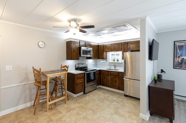 320 Circle Ave Unit 102, Forest Park, IL 60130 - kitchen featuring appliances with stainless steel finishes, crown molding, a ceiling fan, light countertops, and a baseboard radiator