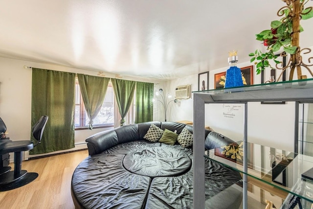 1619 N 35th Ave, Melrose Park, IL 60160 - bedroom with wood finished floors, a wall unit AC, and baseboard heating