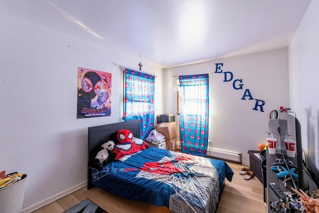 1619 N 35th Ave, Melrose Park, IL 60160 - bedroom with a baseboard radiator, wood finished floors, and baseboards