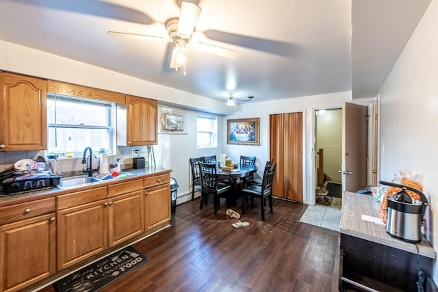 1619 N 35th Ave, Melrose Park, IL 60160 - kitchen with ceiling fan, dark wood finished floors, brown cabinetry, and baseboard heating