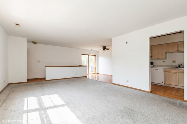 1141 Greenwood Cir Unit 7F, Woodstock, IL 60098 - unfurnished living room featuring light colored carpet and a ceiling fan