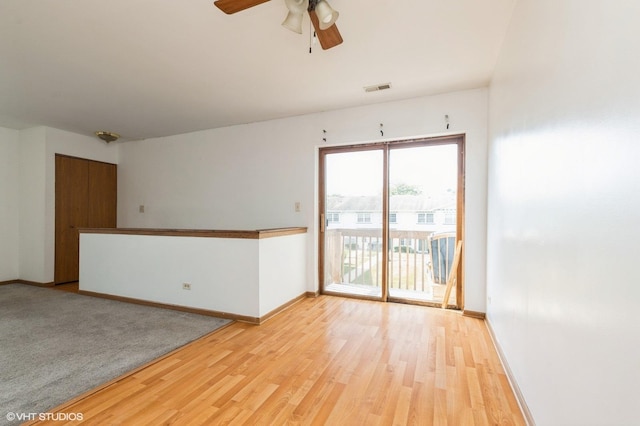 1141 Greenwood Cir Unit 7F, Woodstock, IL 60098 - unfurnished room with light wood finished floors and ceiling fan