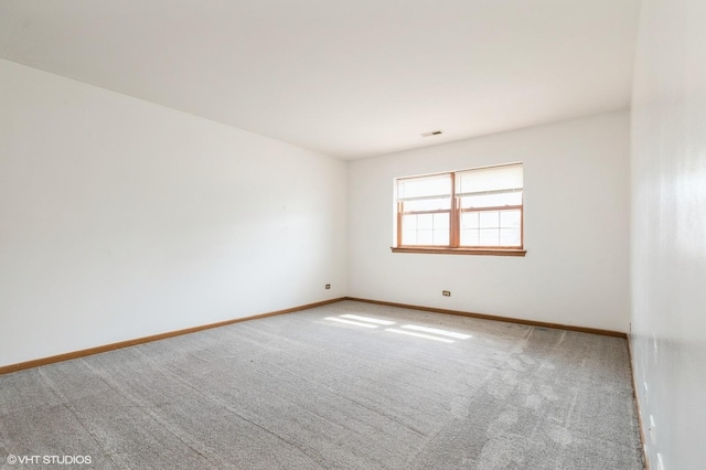 1141 Greenwood Cir Unit 7F, Woodstock, IL 60098 - unfurnished room featuring carpet floors and baseboards