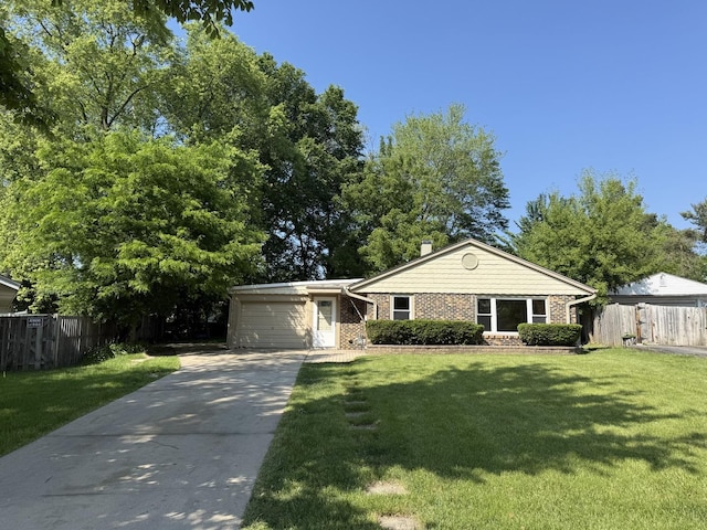 127 Birch St, Carpentersville, IL 60110 - view of front of home featuring concrete driveway, brick siding, an attached garage, and a chimney