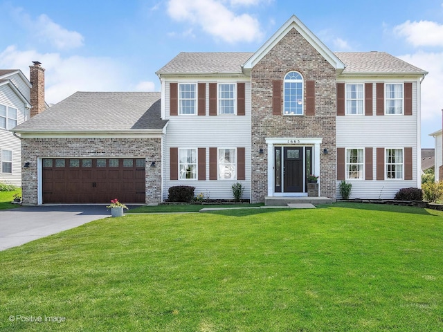 1665 Whispering Oaks Ct, West Chicago, IL 60185 - view of front of home featuring a front lawn, asphalt driveway, a garage, brick siding, and a shingled roof