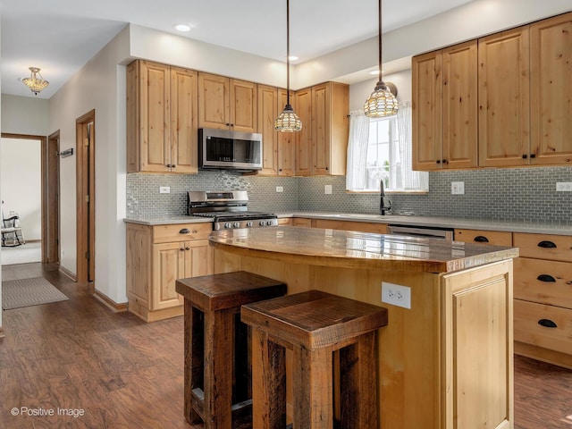 1665 Whispering Oaks Ct, West Chicago, IL 60185 - kitchen featuring stainless steel appliances, dark wood-type flooring, light brown cabinetry, a center island, and backsplash