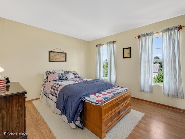 1665 Whispering Oaks Ct, West Chicago, IL 60185 - bedroom with light wood-style flooring and baseboards