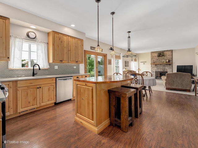 1665 Whispering Oaks Ct, West Chicago, IL 60185 - kitchen featuring stainless steel dishwasher, light brown cabinetry, dark wood finished floors, backsplash, and recessed lighting