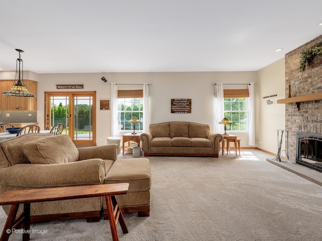 1665 Whispering Oaks Ct, West Chicago, IL 60185 - living room with a fireplace and light colored carpet
