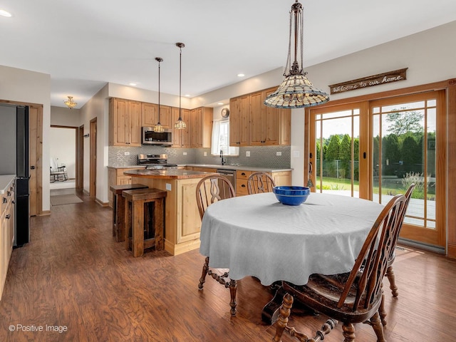 1665 Whispering Oaks Ct, West Chicago, IL 60185 - dining room featuring dark wood-type flooring and recessed lighting