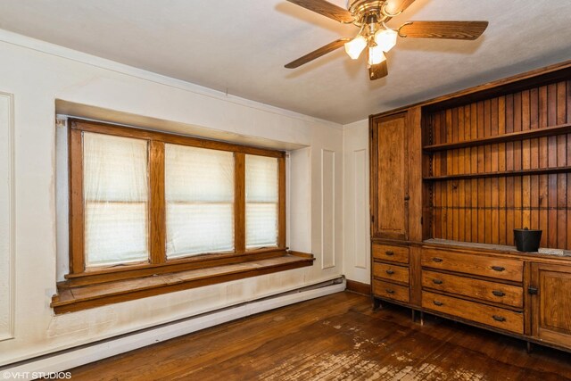 428 Hull Ct, Waukegan, IL 60085 - unfurnished room featuring a baseboard heating unit, dark wood finished floors, ceiling fan, baseboards, and ornamental molding