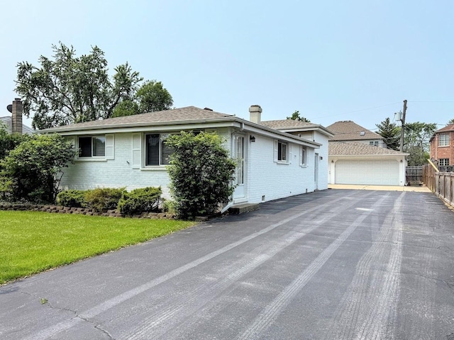 572 N Emroy Ave, Elmhurst, IL 60126 - view of front of home with brick siding, a chimney, roof with shingles, and a garage
