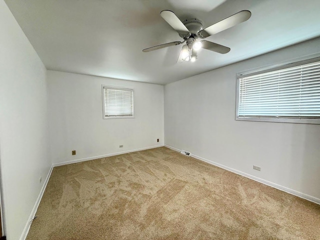 572 N Emroy Ave, Elmhurst, IL 60126 - unfurnished room featuring carpet floors, a ceiling fan, and plenty of natural light