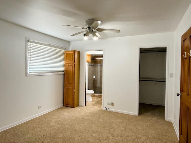 572 N Emroy Ave, Elmhurst, IL 60126 - unfurnished bedroom with light carpet, a walk in closet, a closet, ensuite bathroom, and ceiling fan