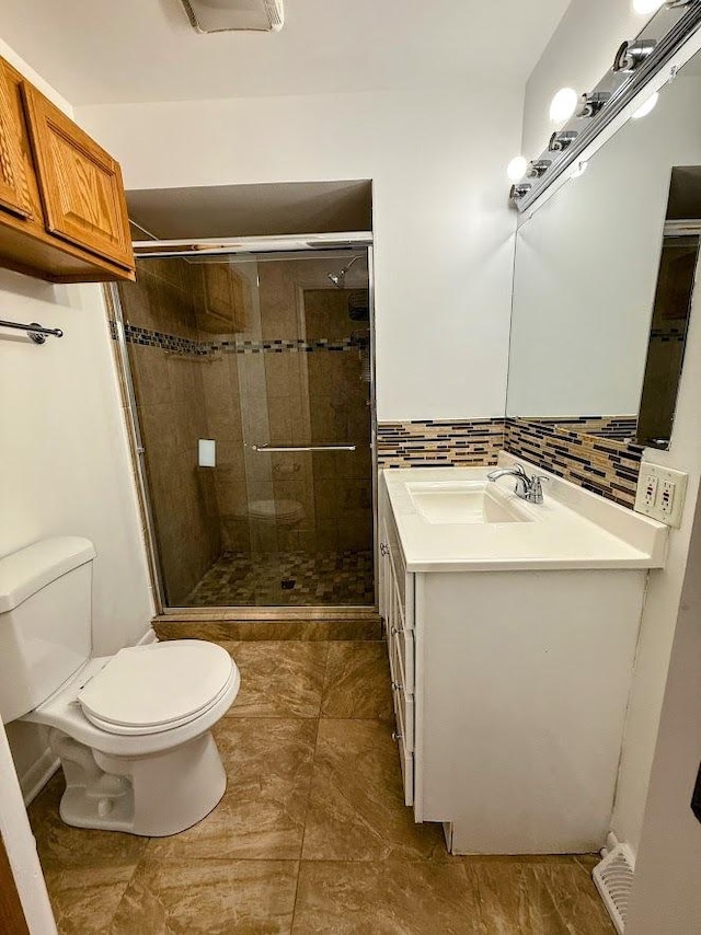 572 N Emroy Ave, Elmhurst, IL 60126 - full bathroom with vanity, a shower stall, backsplash, and tile patterned floors