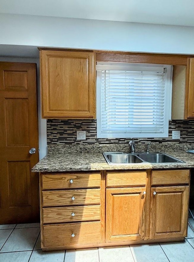 572 N Emroy Ave, Elmhurst, IL 60126 - kitchen featuring light tile patterned flooring, tasteful backsplash, stone counters, and brown cabinets