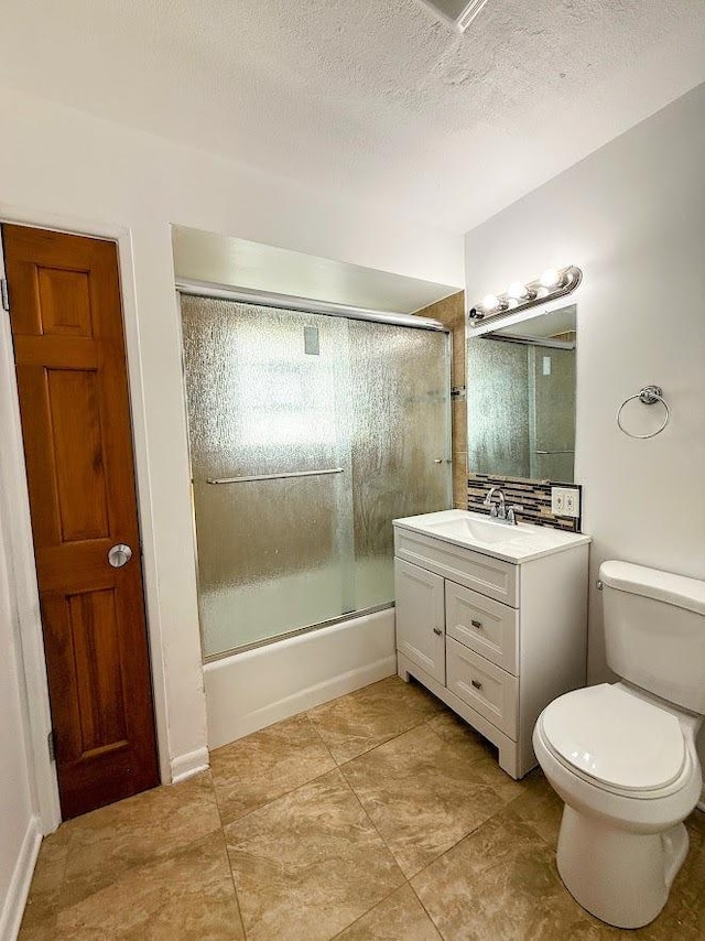 572 N Emroy Ave, Elmhurst, IL 60126 - full bathroom with vanity, bath / shower combo with glass door, tile patterned floors, and a textured ceiling