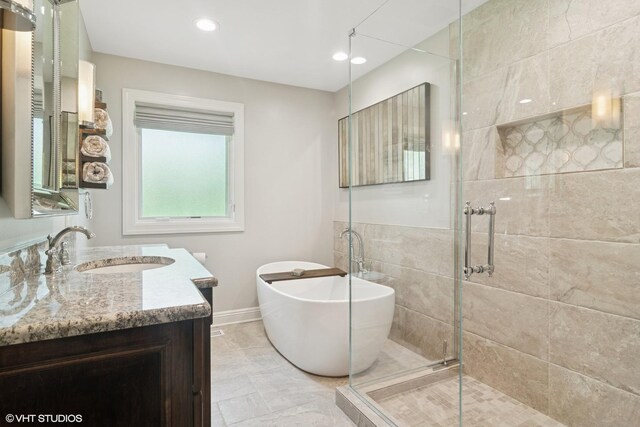 231 N Forest Ct, Addison, IL 60101 - full bath featuring a freestanding tub, a stall shower, vanity, baseboards, and recessed lighting