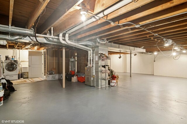 231 N Forest Ct, Addison, IL 60101 - unfinished basement featuring heating unit, separate washer and dryer, and gas water heater