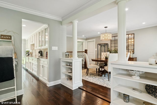 231 N Forest Ct, Addison, IL 60101 - hall with ornate columns, dark wood-type flooring, recessed lighting, crown molding, and baseboards