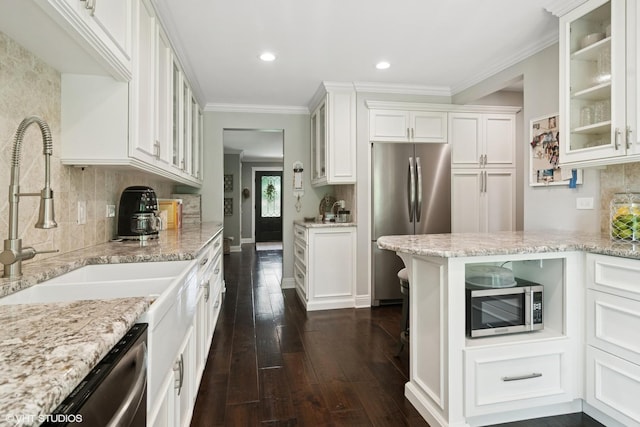 231 N Forest Ct, Addison, IL 60101 - kitchen featuring appliances with stainless steel finishes, white cabinetry, light stone counters, dark wood finished floors, and recessed lighting
