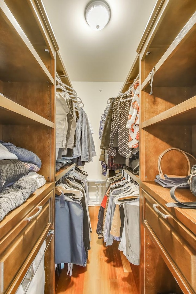 2709 W Bryn Mawr Ave Unit 4, Chicago, IL 60659 - walk in closet featuring wood finished floors