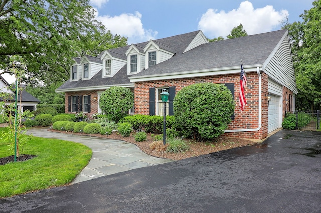 1925 Kentwood Ct, Darien, IL 60561 - new england style home with brick siding, roof with shingles, and a garage