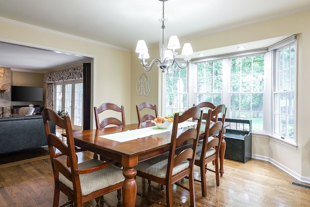 1925 Kentwood Ct, Darien, IL 60561 - dining room with light wood finished floors, crown molding, and a chandelier