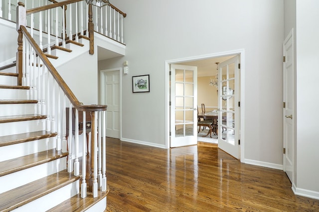 1925 Kentwood Ct, Darien, IL 60561 - stairway with wood finished floors, a towering ceiling, and a chandelier