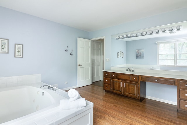 1925 Kentwood Ct, Darien, IL 60561 - bathroom featuring a jetted tub, vanity, and wood finished floors