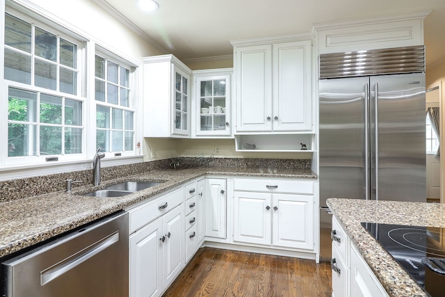1925 Kentwood Ct, Darien, IL 60561 - kitchen featuring appliances with stainless steel finishes, white cabinetry, light stone countertops, glass insert cabinets, and dark wood-type flooring