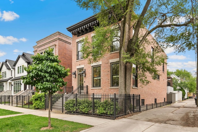 2429 W Belden Ave, Chicago, IL 60647 - view of building exterior featuring a fenced front yard