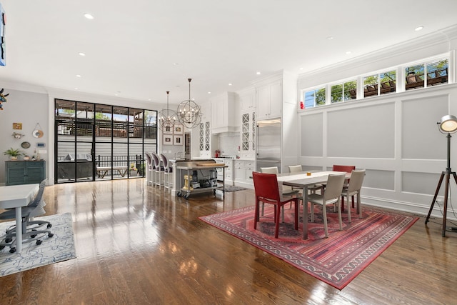 2429 W Belden Ave, Chicago, IL 60647 - dining area with a chandelier, ornamental molding, wood finished floors, and recessed lighting