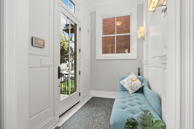 2429 W Belden Ave, Chicago, IL 60647 - entryway featuring ornamental molding, healthy amount of natural light, and tile patterned flooring