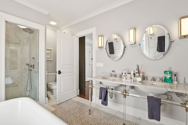 2429 W Belden Ave, Chicago, IL 60647 - bathroom featuring a stall shower, a freestanding bath, double sink, crown molding, and tile patterned flooring